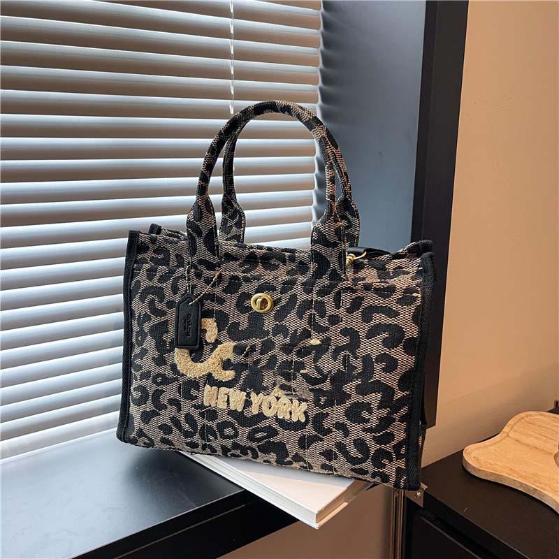 2025 Hot-Selling Large Capacity Canvas Tote: Stylish Commuter & Crossbody Bag.