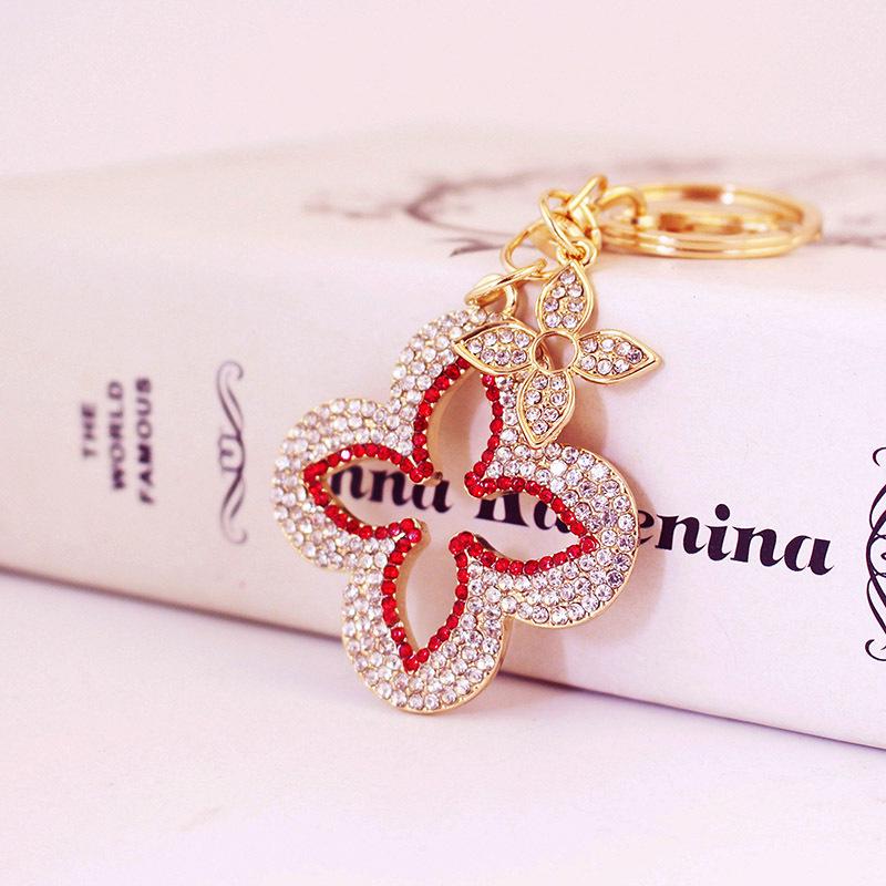 Exquisite Four-Leaf Clover Alloy Keychain Charm - Perfect Gift for Girlfriend, Bag Accent, or Keyring Accessory.