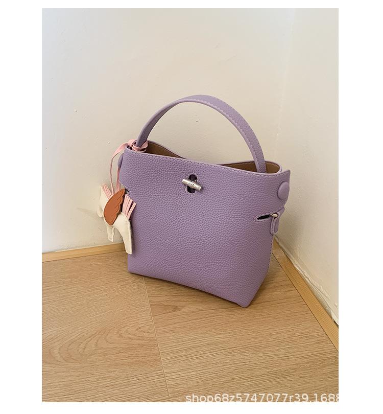 2025 Spring and Summer New Korean Bucket Bag Niche Casual One-shoulder Crossbody Hand-held Commuter High-end Women's Bag