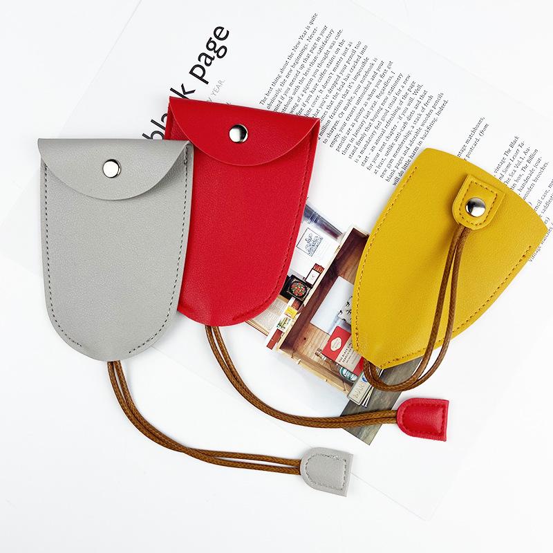"Compact PU Leather Key Storage Pouch with Pull-Out Feature"