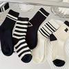 5 pairs of fashionable black and white mid tube socks, unisex, with black and white striped design