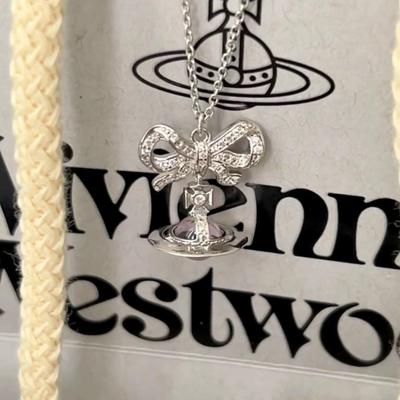 Серьги-пусеты с бантом и планетой-сферой из серебристо-розового циркона вдовствующей императрицы и ожерелье