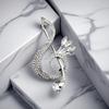 Exquisite Silver Music Note Brooch for Women - Fashionable Lapel Pin for Coats and Suits, Luxurious Accessory