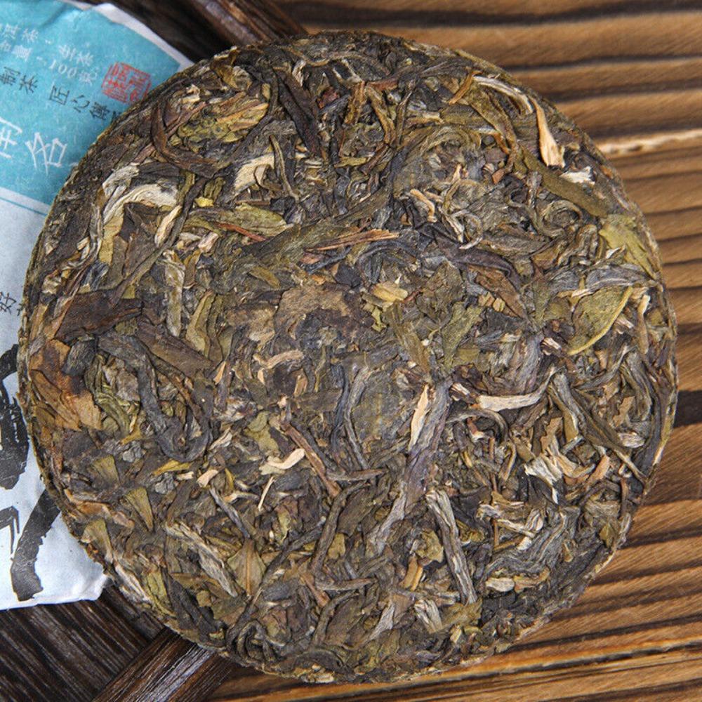 100 г чая пуэр с древнего дерева Цзинмай - ароматизированный пирог с орхидеей горы Мин