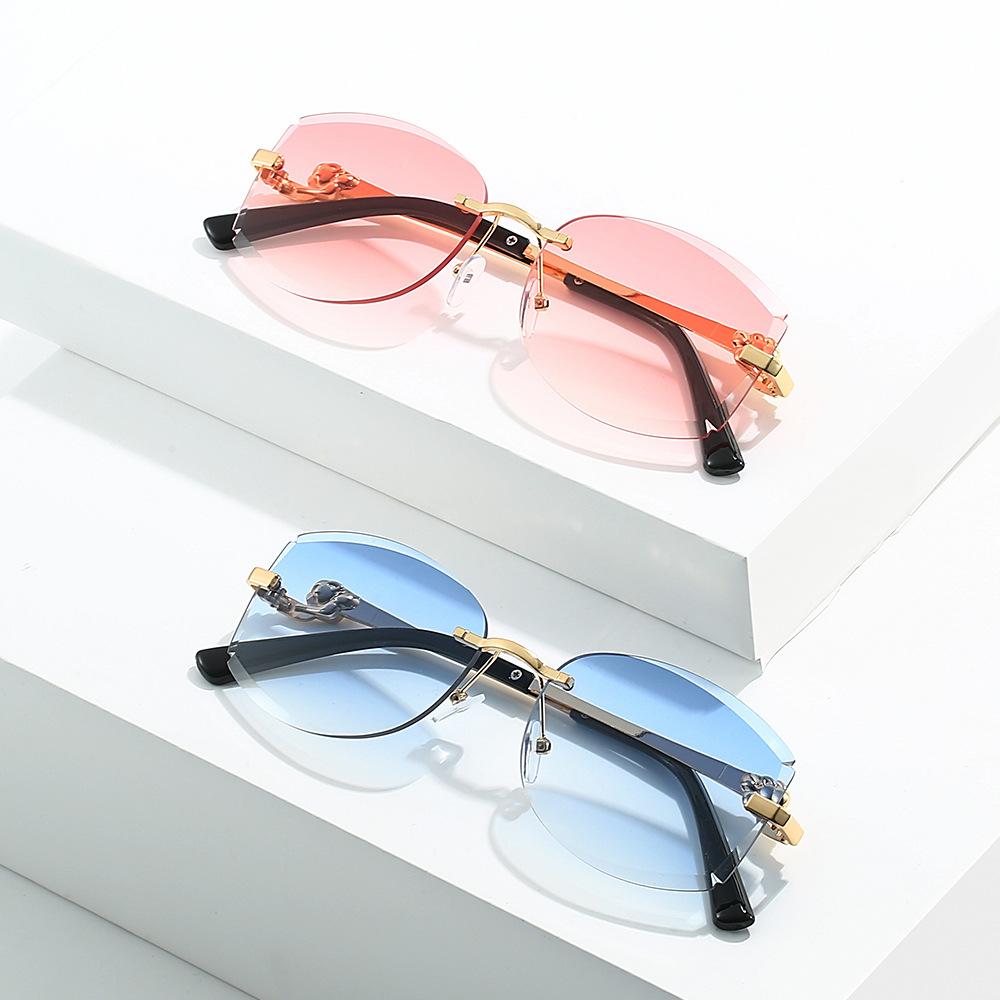 New large-frame sunglasses frameless thin sunglasses women's metal fox head UV protection driving trimmed glasses tide