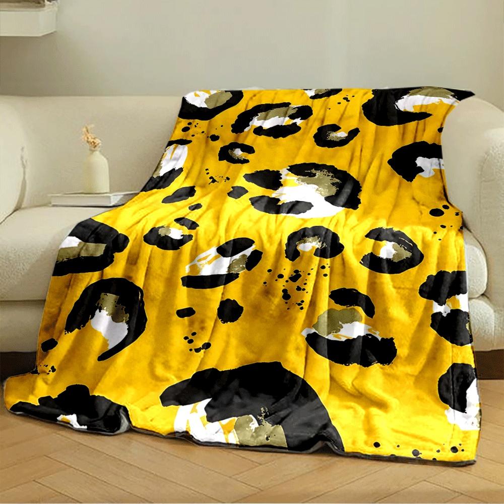 Abstract leopard print with black, white, and olive spots on yellow. for all seasons blanket lunch break throw gift