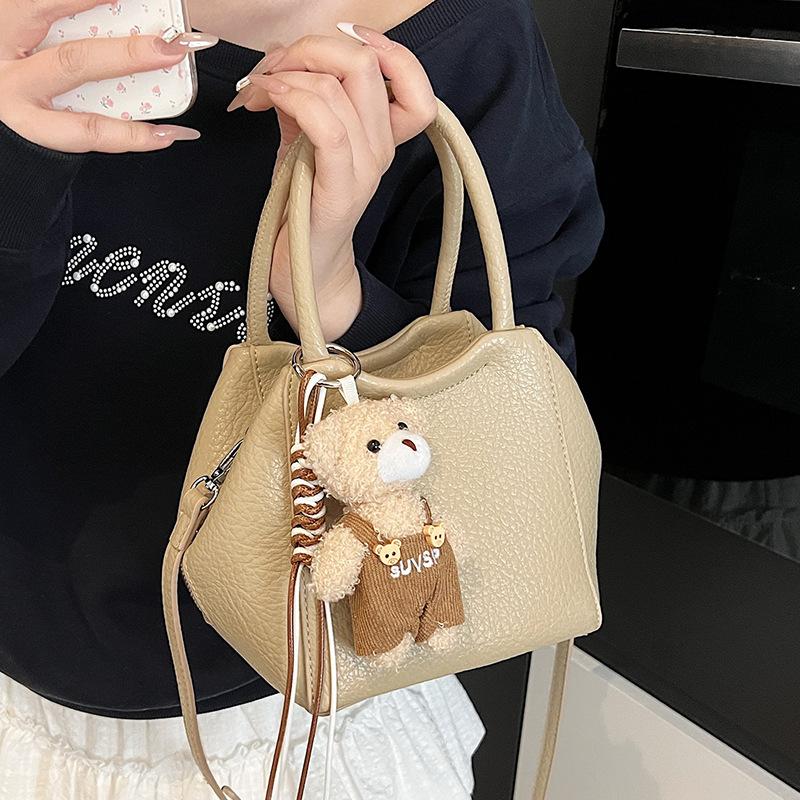 Оптовая мода высокое чувство простой стиль однотонный узор личи сумка-ведро повседневная универсальная сумка-мессенджер для通勤 для женщин