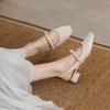 With skirt fashion bag head sandals women's 2025 new French pearl thick heel single shoes back empty evening wind lady shoes