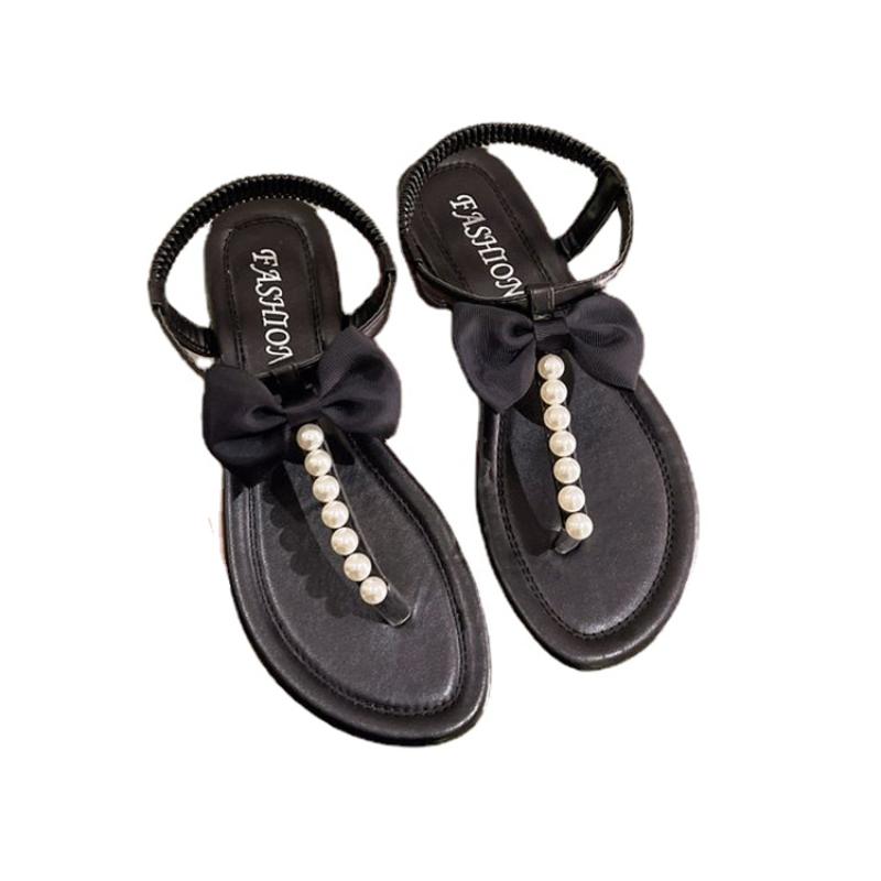 Женские босоножки Temperament 2024 года, летние новые женские шлепанцы с жемчугом, пляжные, плоские, на открытом воздухе, противоскользящие, с бантом, одинарные туфли