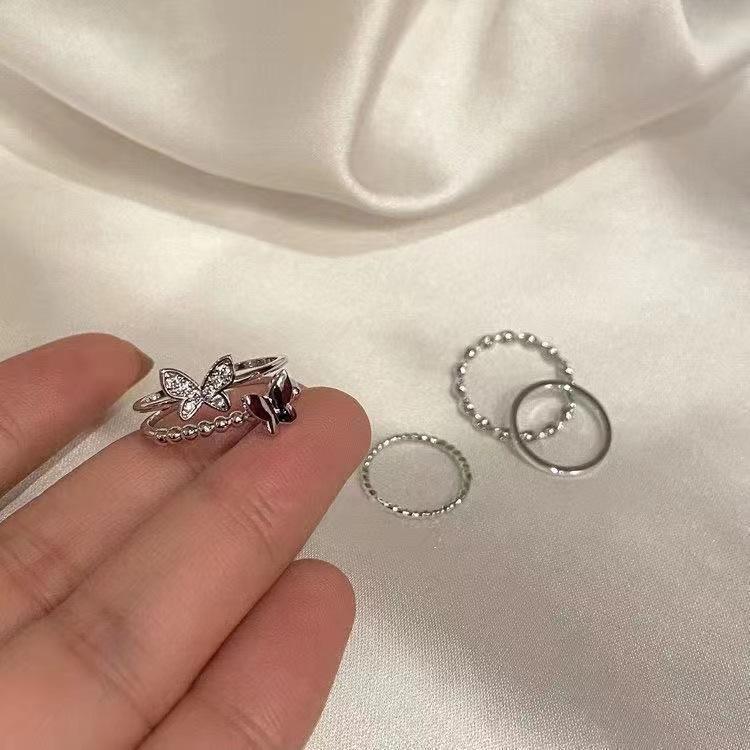 Exquisite value butterfly twisted four-piece ring women's light luxury niche design sense fashion personality temperament index finger ring