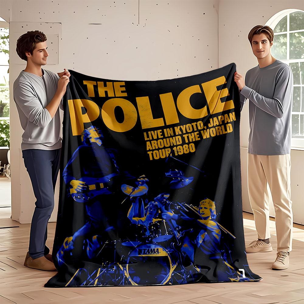 Musicians performing energetically with bold yellow text on a dark background. for all seasons blanket lunch break throw gift