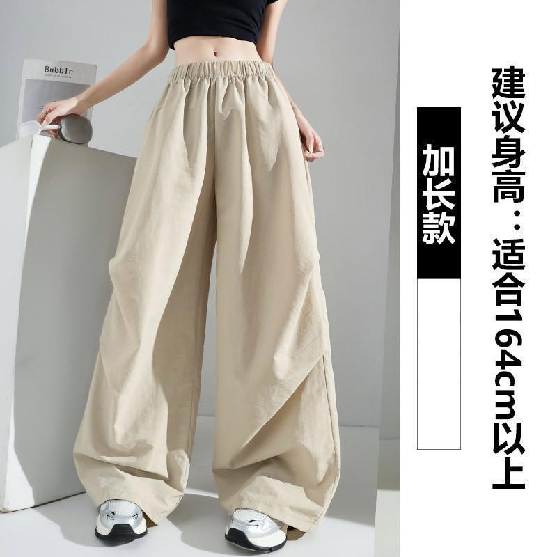 Желтый спортивный комбинезон женский летний тонкий повседневный свободный драпированный с маленькой высокой талией тонкие брюки парашюты с широкими штанинами