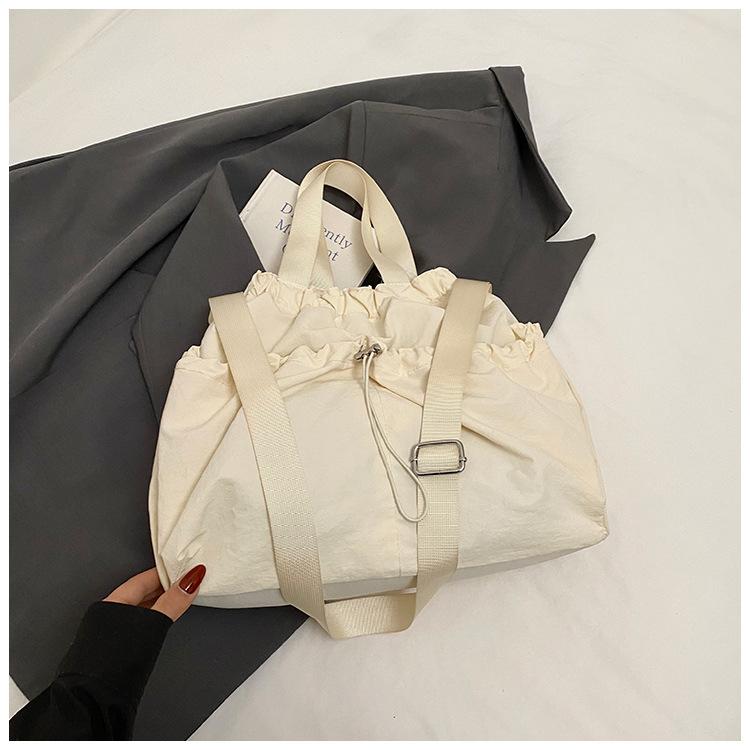 2025 Japanese Hansen Lazy Wind Canvas Bag Women's Large Capacity Drawstring Handbag High Value College Student Class Bag