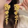 Серьги-кисточки с золотым цветком: Новый китайский стиль, эксклюзивный дизайн для невест с квадратным лицом