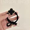 Korean High-End Four-Leaf Clover Hair Tie for Women - Non-Tightening Summer Ponytail Accessory with Black Leather Case