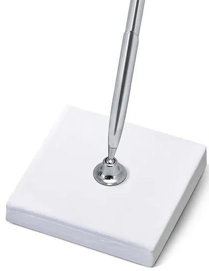 Stand with a silver pen for guest registration