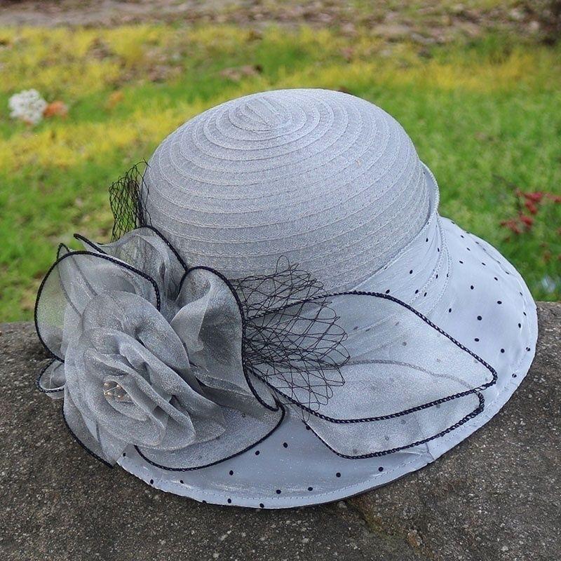 Breathable hat European and American gauze hat Eugen yarn flower UV protection seaside sunshade spring and summer middle-aged and elderly travel top