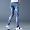 Джинсы мужские тонкие осенние мужские повседневные свободные прямые эластичные маленькие дырочки для ног корейская версия трендовых брюк