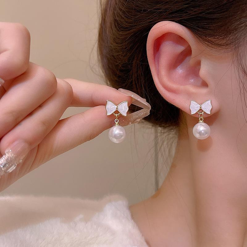 Серьги-бантики из серебра 925 пробы с жемчугом — модный, элегантный, универсальный дизайн