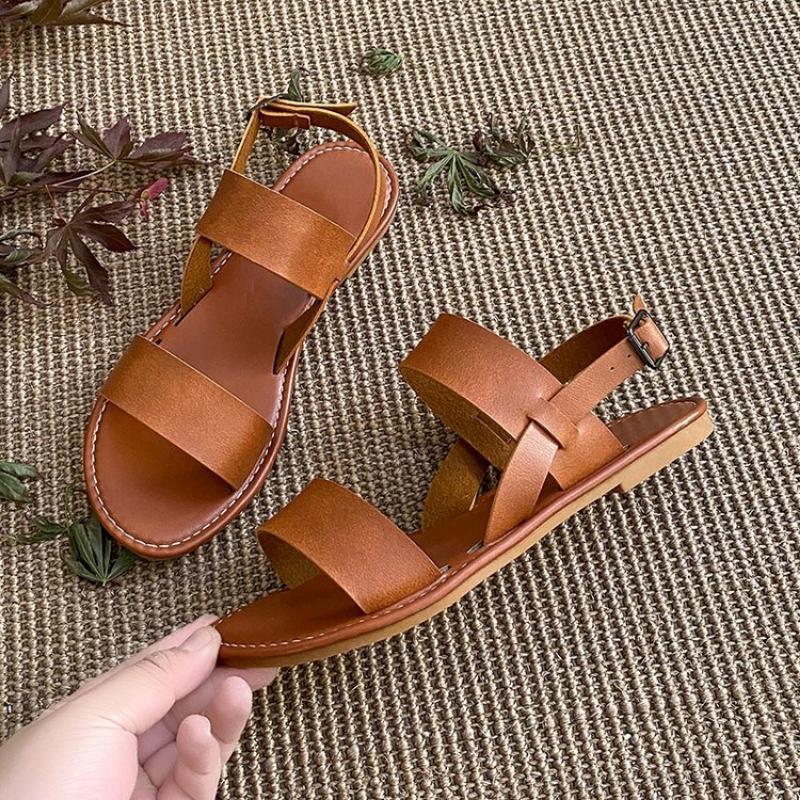 Женские сандалии на плоской подошве 2024 года, новые кожаные с перекрестными ремешками из Европы и Америки, высококачественные летние женские туфли, пляжные сандалии с пряжкой и ремешком