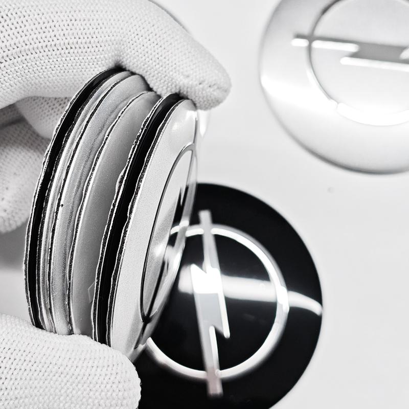 AAAYW1 4pcs 56mm 60mm 65mm Car Wheel Center Stickers Hup Emblem For Opel Insignia Astra J F Antara Meriva Zafira H G Corsa Vectra OPC