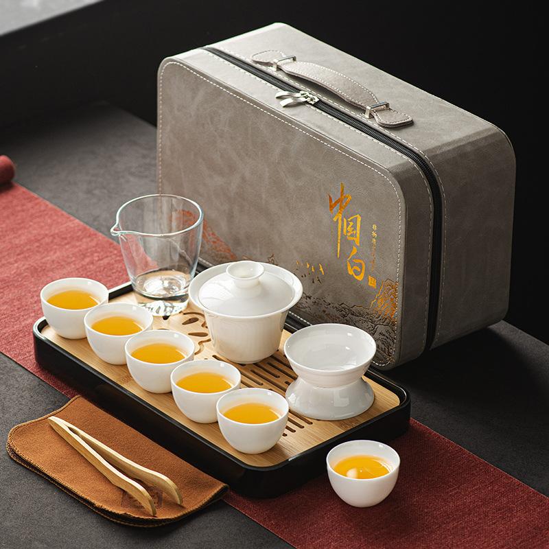 Suet jade white porcelain tea set, full set of kung fu tea set cover bowl tea cup travel tea set gift box print