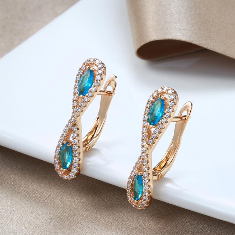 Серьги Kinel с симметричным розовым золотом и синим цирконом