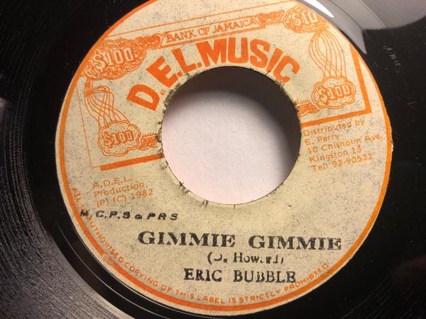 7-дюймовая пластинка ERIC BUBBLE - Gimme Gimme NONE D.E.L. Музыка 1982 Ямайка Регги, Ска и Даб Б/у