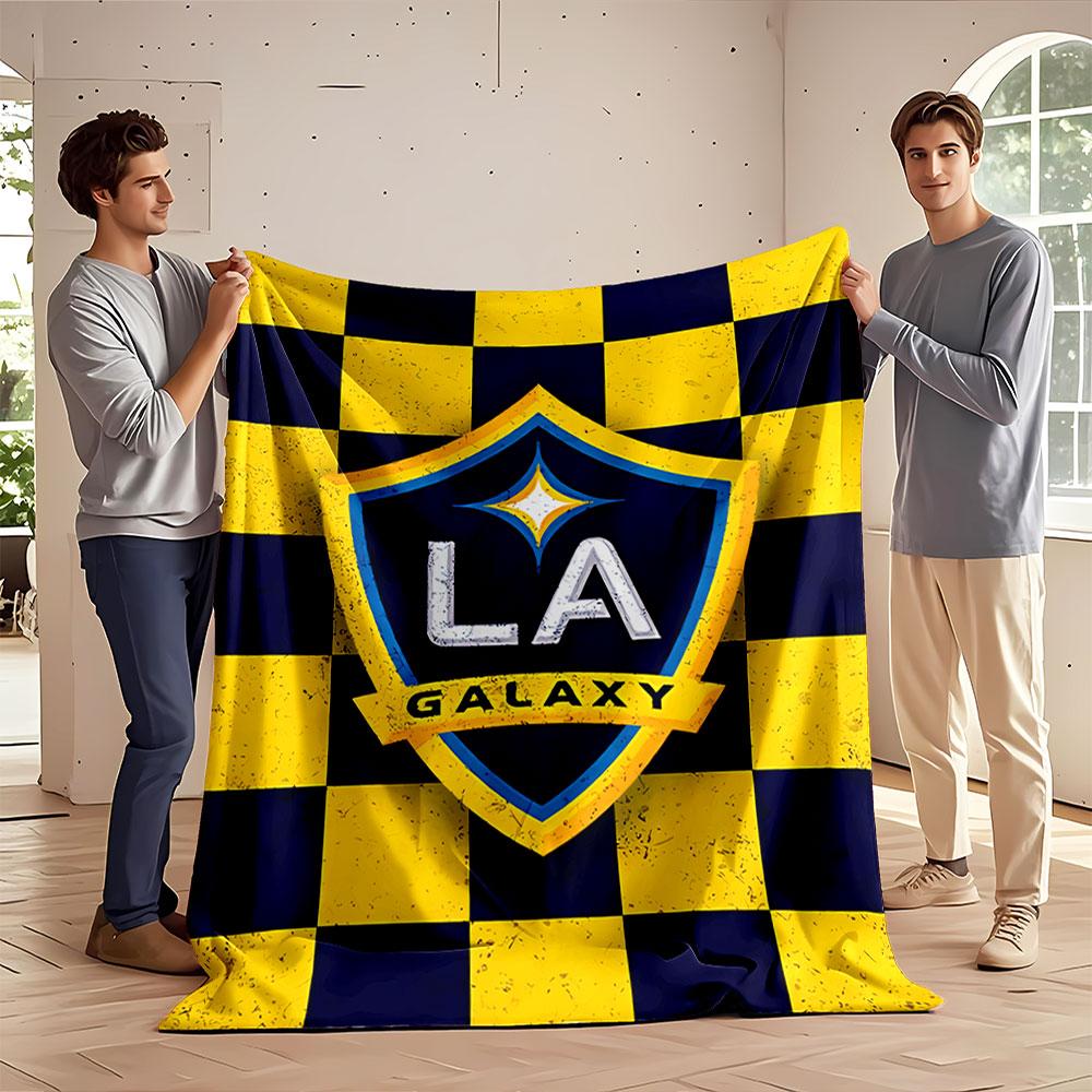 Blue and yellow checkered background with a shield logo in the center. for all seasons blanket lunch break throw gift