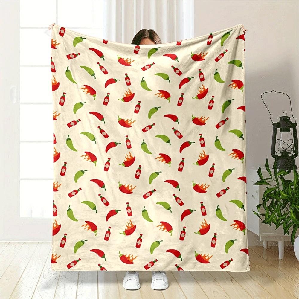 The pattern shows chilies, hot sauce bottles, and flaming chili peppers. for all seasons blanket lunch break throw gift
