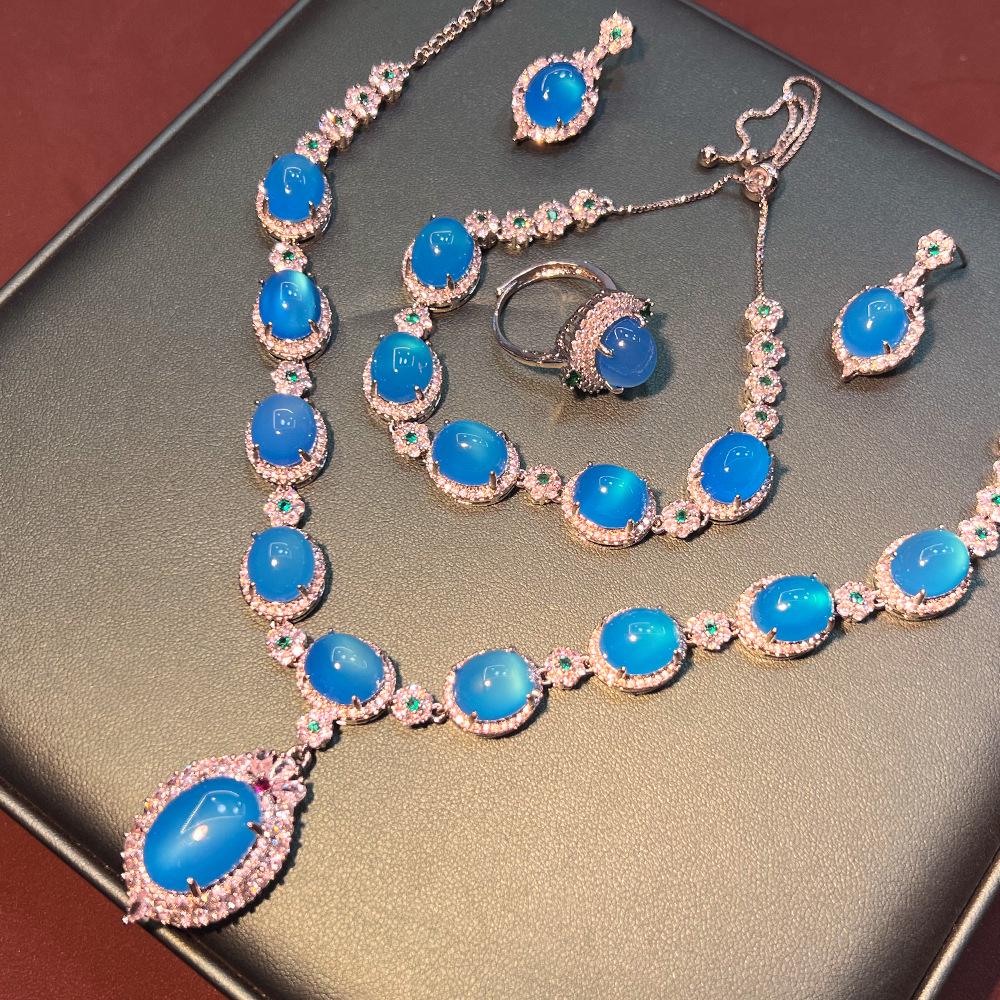 Винтажный китайский ювелирный набор из сапфира и халцедона: Коллекция из четырех предметов высокого класса с посеребрением и медным покрытием