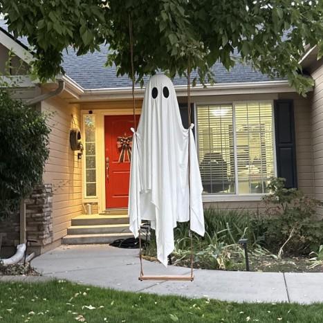Large White Glowing Hanging Ghost Swing Decoration - Spooky Halloween Ornament for Outdoor Porch Doorway Decor