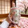 Плетеный ремешок с цветами для бутылок с водой и термокружек