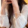 Браслет с цирконами в виде четырехлистника для женщин: Модные 2026 года Высококлассные Легкая Роскошь Ручные Украшения