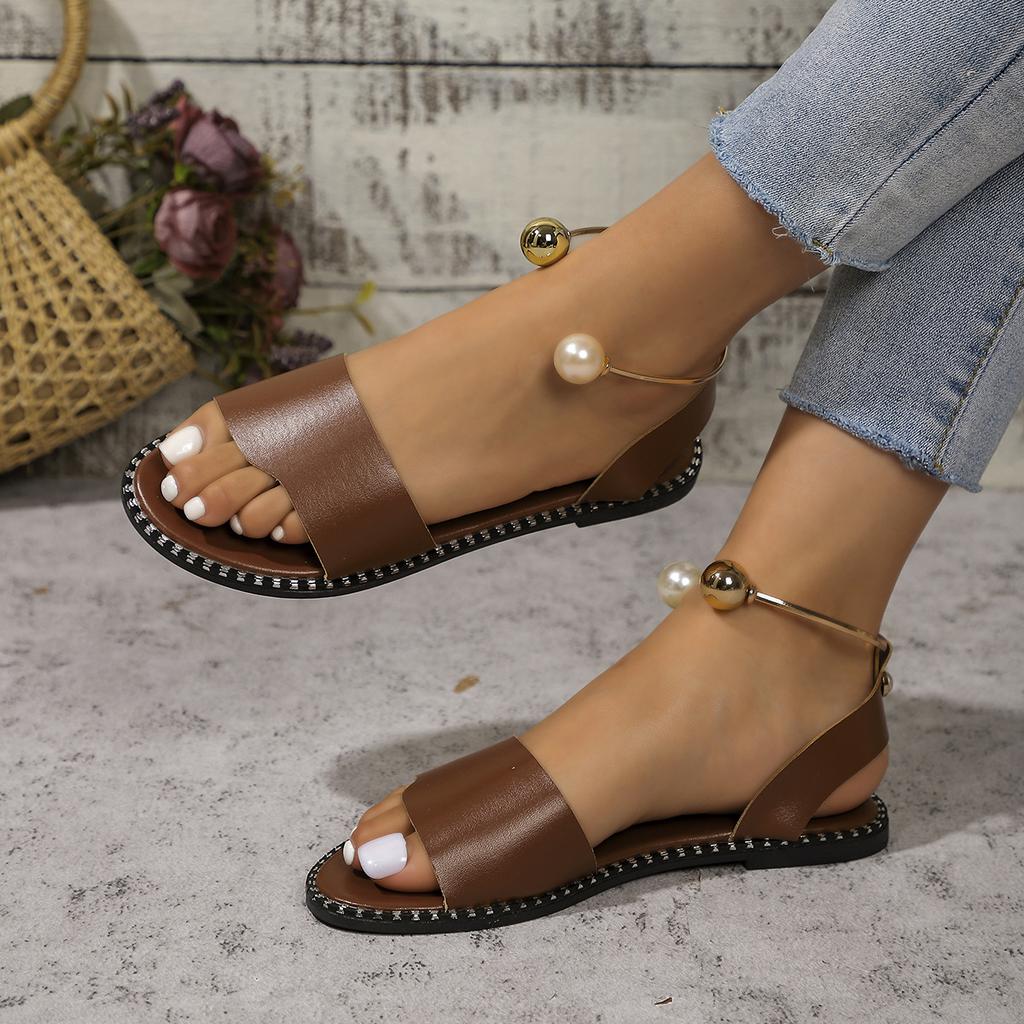 European and American one-word buckle flat sandals women's new open-toed simple pearl metal buckle cool slippers
