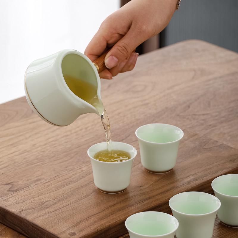 Jade Green Travel Tea Set: One Pot, Four Cups, with Wooden Side Handle and Tea Caddy.