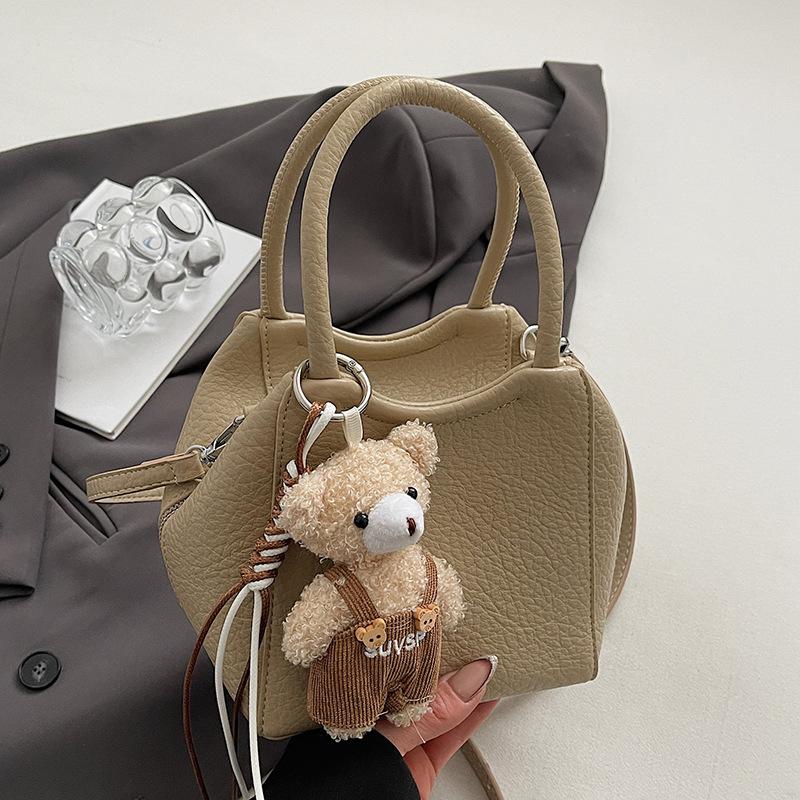 Оптовая мода высокое чувство простой стиль однотонный узор личи сумка-ведро повседневная универсальная сумка-мессенджер для通勤 для женщин