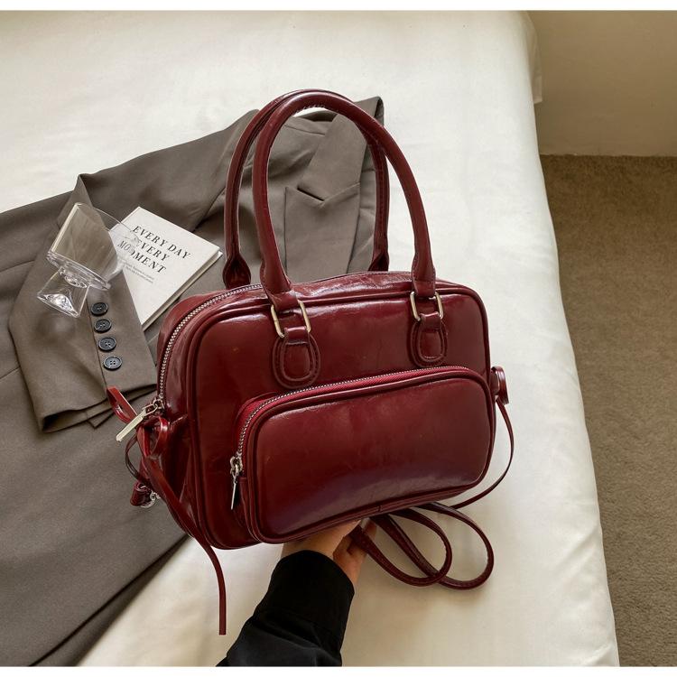 Рюкзак Женский рюкзак 2025 Новый Большая вместимость Нишевый Простой Городской Колледж Колледжный стиль Кожаная школьная сумка