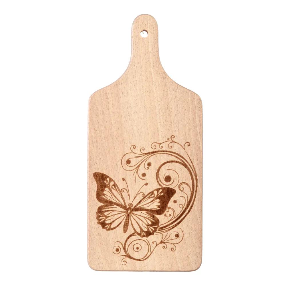 Wooden chopping board with an engraved butterfly