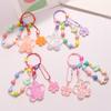 Брелок для ключей с большим цветком в виде масляного струящегося песка и милыми красочными аксессуарами в виде сакуры, подвеска для женщин, чехол для наушников, украшение на сумку