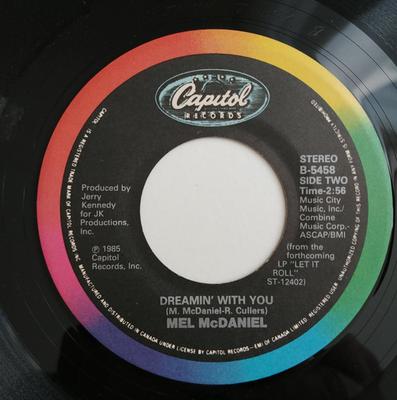 7-дюймовая пластинка MEL MCDANIEL Let It Roll Let It Rock B5458 CAPITOL 1984 Канада CountryFolk Б/у