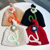 Hand crocheted coarse wool hat women's autumn and winter warm ear protection hat 2024 Korean version three-dimensional flower bag head cold hat