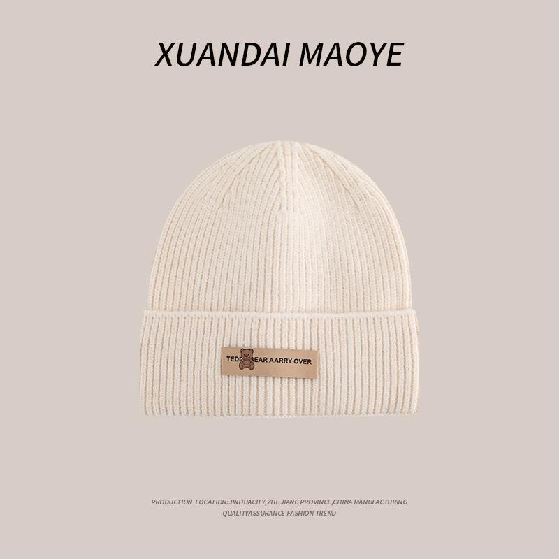 Осенние и зимние шапки женские плюшевые новые вязаные шапки универсальные теплые защитные наушники шерстяные утолщенные модные студенческие шапки