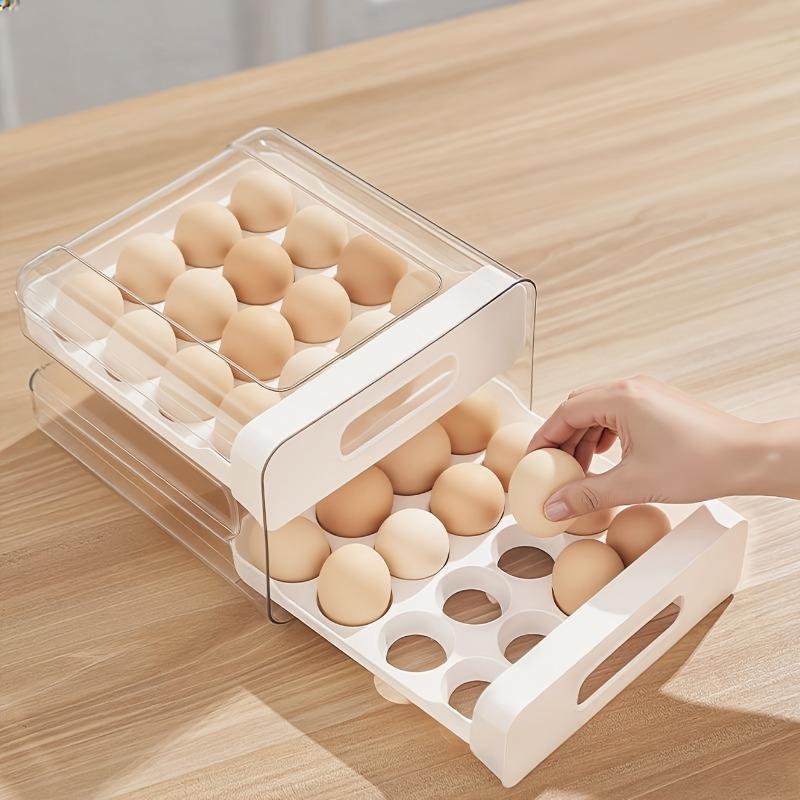 Double-layer 32-grid drawer-style egg storage box made of PET and PP. Space-saving fridge organizer keeps eggs fresh and neatly arranged.