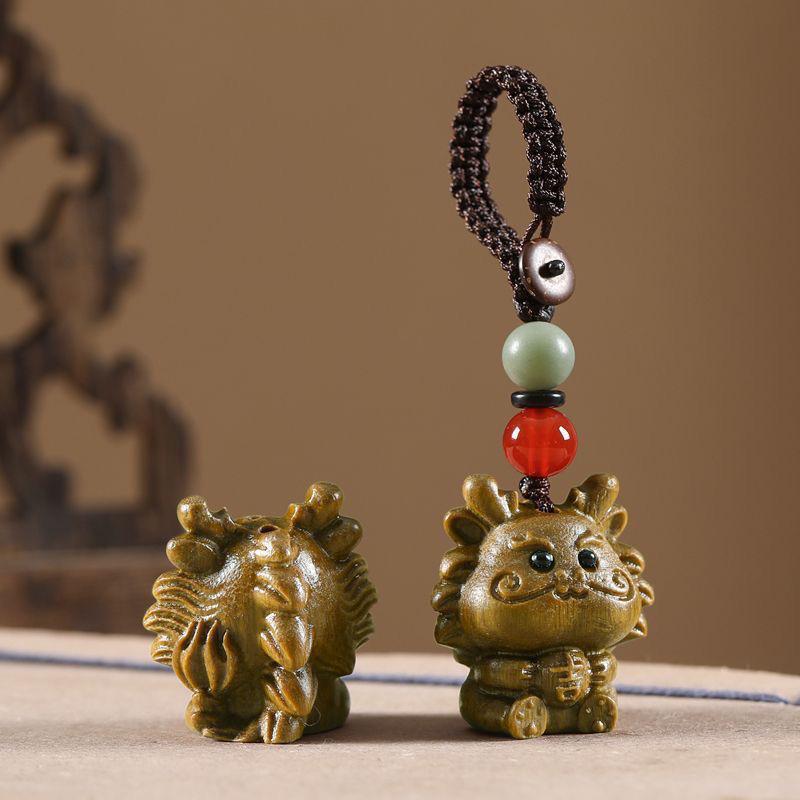 Twelve Zodiac Animal Charms Green Sandalwood Set: Rat, Ox, Tiger, Rabbit, Dragon, Snake, Horse, Sheep, Monkey, Rooster, Dog, Pig.