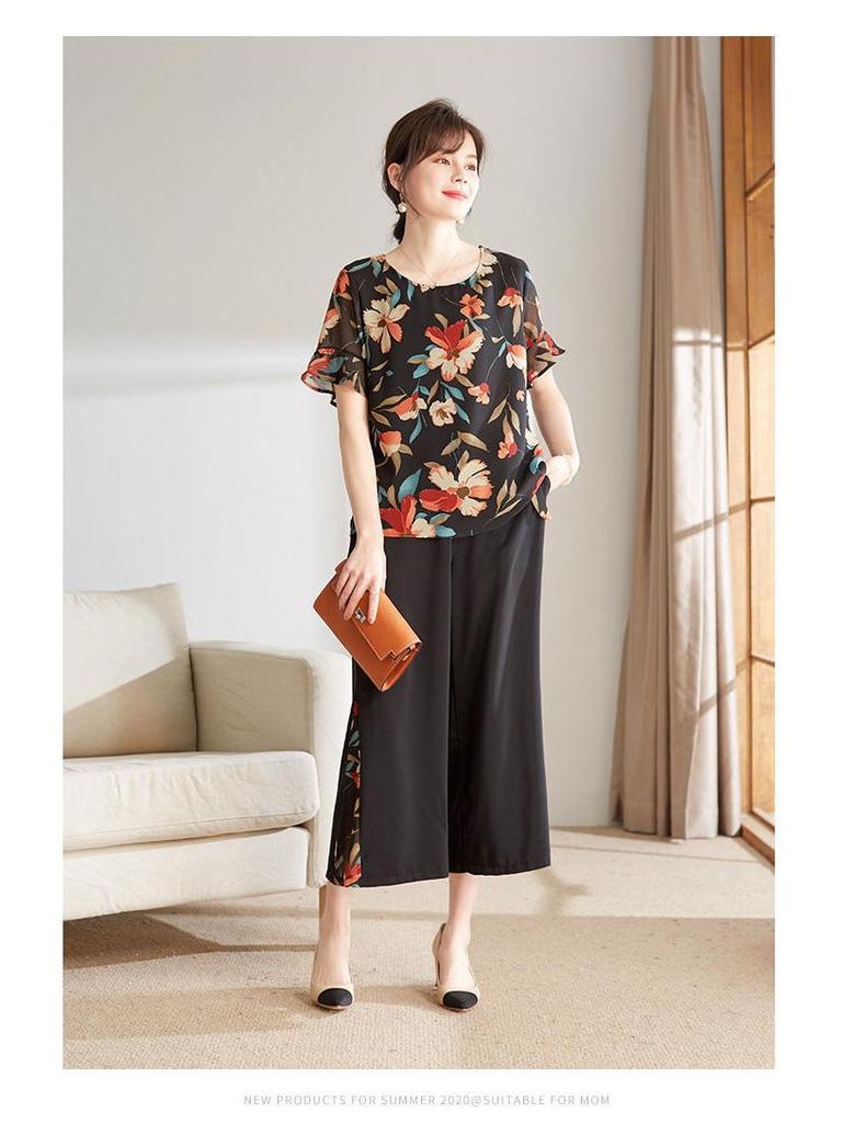 Летний стильный комплект из рубашки с цветочным принтом и широких брюк для женщин 2025 года