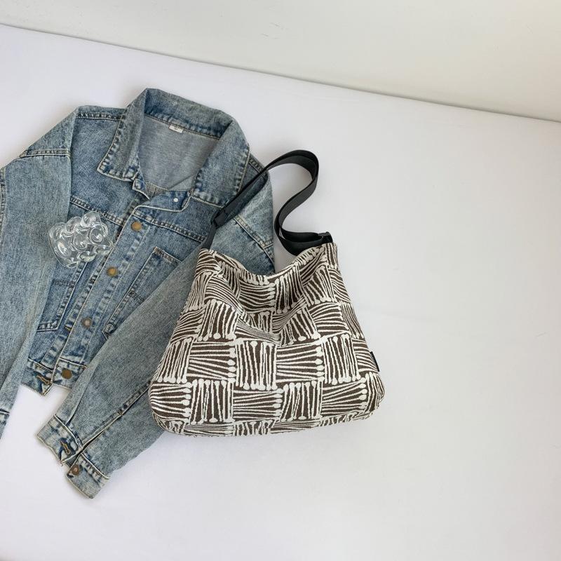 Тканевая сумка 2025 осень новая большая вместимость холст высокая ценность клетка широкий плечевой ремень одно плечо мессенджер сумка-тоут