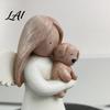 Nordic Style Angel Figurine Holding Puppy Figurine Cute Dog Resin Statue for Home Cozy Atmosphere Desktop Ornaments Desk Decor Handcrafted
