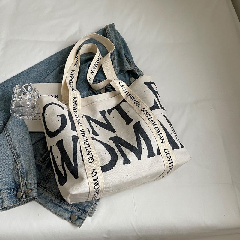 2025 Модная холщовая сумка Ленивый ветер Японская Большая вместимость Студенческая холщовая сумка Ремешок с алфавитом Сумка-тоут