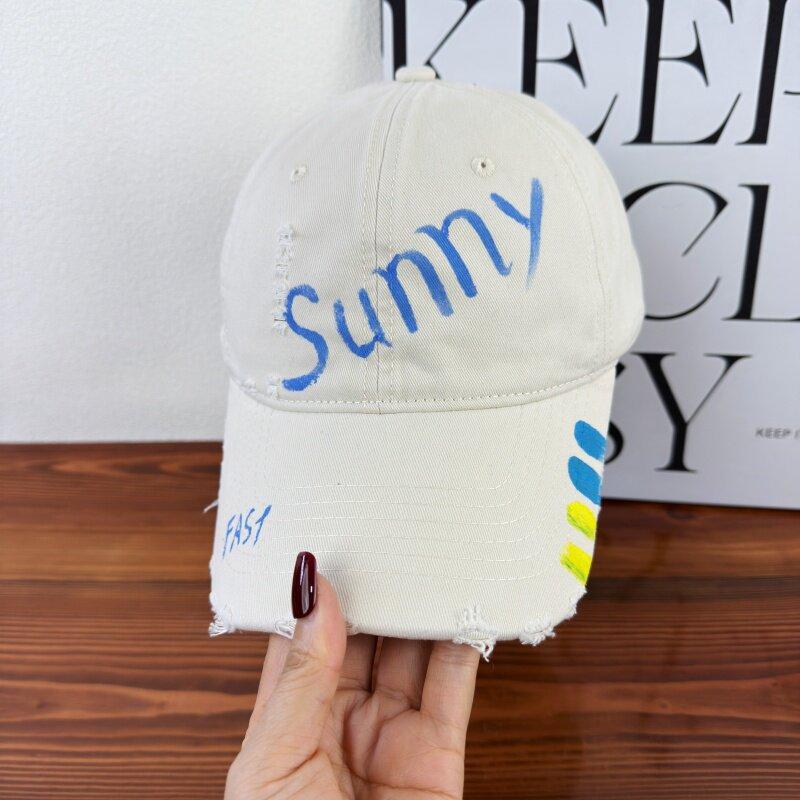 Fashion original design soft top baseball cap women's sunscreen cap men's new spring and summer hole painting letters fashion versatile